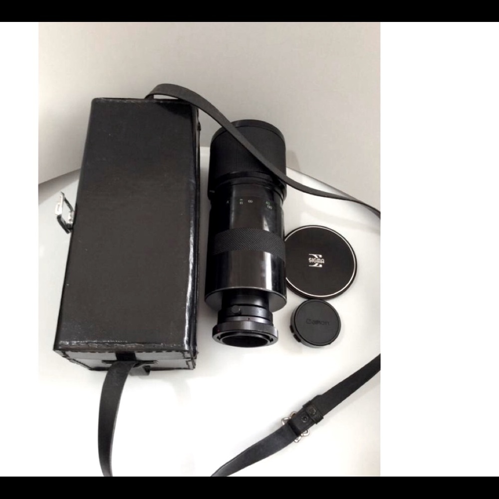 Vintage camera lens and case